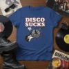 Disco Sucks t-shirt with a retro design featuring a guitar, disco ball, and thumbs down graphic