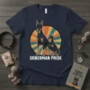 Doberman Pride t-shirt featuring two Doberman dogs and a retro sunburst graphic