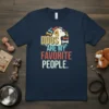Dogs Are My Favorite People text with dog graphic and bone accents on a navy blue t-shirt