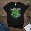 Black t-shirt with "DONATE LIFE BE AN ORGAN DONOR" text and green kidney and heart graphic