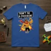Funny "DON'T BE A CHICKEN!" t-shirt design with a muscular cartoon chicken flexing and a red cape