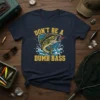 Don't Be A Dumb Bass humorous fishing quote on a navy t-shirt with a largemouth bass graphic