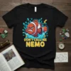 T-shirt with a grumpy orange and white clownfish graphic that says "DON'T CALL ME NEMO" in yellow and blue text