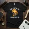 Black t-shirt with white text "DON'T DEFINE ME I KNOW WHO I AM" and a graphic of a robot head
