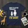 T-shirt with "Don't Flatter Yourself I Only Look Up To You Because I'm Short" text and stick figures of different