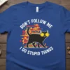 Blue t-shirt with white text "DON'T FOLLOW ME I DO STUPID THINGS" and a graphic of a black cat wearing