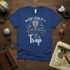 Don't Grow Up It's A Trap text with hot air balloon and cityscape graphic on a navy blue t-shirt