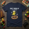Don't Grow Up (It's A Trap) quote with a running bear graphic on a navy t-shirt