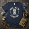 Navy t-shirt with "Don't Hate Meditate" text, brain, and lotus graphic in a circle
