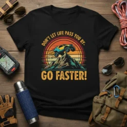 T-shirt with "Don't Let Life Pass You By. Go Faster!" quote and off-road vehicle jumping a mountain graphic