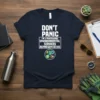 Navy t-shirt with "Don't Panic I'm a Professional Environmental Services Representative" text and eco-themed icons