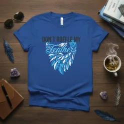 Don't Ruffle My Feathers quote with stylized eagle and feather graphic on a blue t-shirt