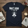 Don't Stop Praying t-shirt with praying hands graphic and cross, faith-inspired Christian apparel