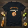 Black t-shirt with "Don't Touch My Ginger Ale" text in orange and white, featuring a hand holding a ginger ale