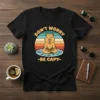 Don't Worry Be Capy T-Shirt with a meditating capybara graphic and retro sunset background