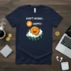 Don't Worry, Bitcoin Happy! text with a smiling Bitcoin coin graphic on a navy blue t-shirt