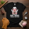Chef pig wearing a hat and apron holding knives, with text "Don't Worry I Hugged Them First" on a black