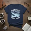 Don't Worry You'll Pass Out Before You Die quote t-shirt with a sleeping figure on clouds and a clock graphic