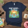 DON'T WORRY... Be Capy text with three capybaras relaxing in a tropical pond at sunset, navy t-shirt design