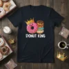 Donut King text with a cartoon donut wearing a crown, stacked donuts graphic, on a navy t-shirt