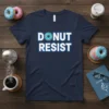 Donut Resist text design with a cartoon donut graphic on a navy blue t-shirt