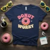 Donut Worry retro graphic t-shirt design featuring pink frosted donut with sprinkles and text "DONUT WORRY"