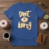 Donut Worry text graphic with a donut illustration on a blue t-shirt