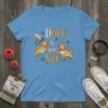 DOOG to see YOU text design with two playful golden puppies on a light blue v-neck t-shirt