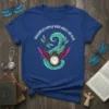 Dragonflies Appear When Angels Are Near quote with a pocket watch and wings graphic on a blue t-shirt