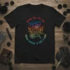 Black t-shirt with colorful text "draw the cat eye sharp enough to kill a man" featuring a stylized eye, sword
