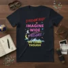 Dream Big! Imagine Wide Dreams! Do Come Though quote on a dark navy t-shirt with colorful, cosmic graphics and city