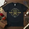 Black t-shirt with gold text "Dream Wealth Health Love" encircling a lotus flower graphic