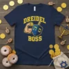 Navy t-shirt with "Dreidel Boss" text in yellow, featuring a muscular arm holding a dreidel coin and a blue dreidel