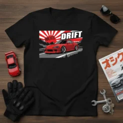 Drift Japanese Car T-Shirt featuring a red sports car, mountains, and rising sun graphic. Includes "DRIFT" and "日本製" text