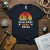DRILL BABY baby DRILL text with oil rig graphic and sunset design on a navy t-shirt