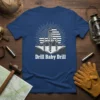 Drill Baby Drill T-Shirt featuring an oil rig graphic with the American flag and sunburst