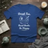 Drink Tea, Read Books. Be Happy. quote on a royal blue t-shirt with an armchair, books, and teacup graphic