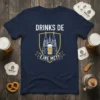 Navy blue t-shirt with "DRINKS DE EJNE MET?" text and a graphic of Cologne Cathedral with a beer glass