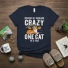 Funny "Driving My Husband Crazy One Cat At A Time" t-shirt design with a crowned cat graphic and bold text