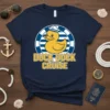 Duck Duck Cruise t-shirt design featuring a sailor duck graphic and bold yellow text on a navy shirt