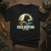 Duck Hunting Est. 1980 t-shirt design featuring a black lab wearing camouflage and a hat, in a circular scene with