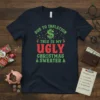 Dark navy t-shirt with "DUE TO INFLATION THIS IS MY UGLY CHRISTMAS SWEATER" text in green, red, and white, featuring