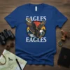 Blue t-shirt with "Eagles Eagles" text and a graphic of a bald eagle in flight over mountains and a sunset