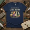 Easily Distracted by Cats & History text with cartoon cats in historical costumes on a navy t-shirt