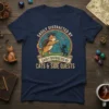 Easily Distracted By Cats & Side Quests text with a cat adventurer and wizard cat graphic on a navy t-shirt