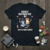 Easily Distracted by Cats & Video Games text with cartoon cats playing video games graphic on a black t-shirt