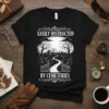 Black t-shirt with white text "Easily Distracted by Cemeteries" above a graphic of a spooky cemetery pathway