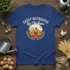 Easily Distracted By Chickens text design with three chickens and a barn graphic, on a blue t-shirt