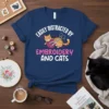 Easily Distracted By Embroidery And Cats t-shirt with a cute cat playing with yarn and scissors