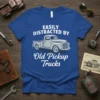 Easily Distracted By Old Pickup Trucks quote on a blue t-shirt with a vintage truck graphic